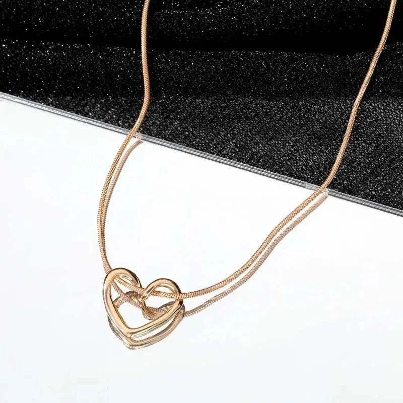Geometric Hollow Heart Necklace – Modern Minimalist Pendant for Women.