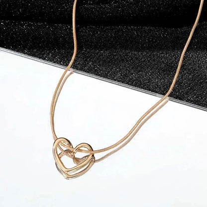 Geometric Hollow Heart Necklace – Modern Minimalist Pendant for Women.