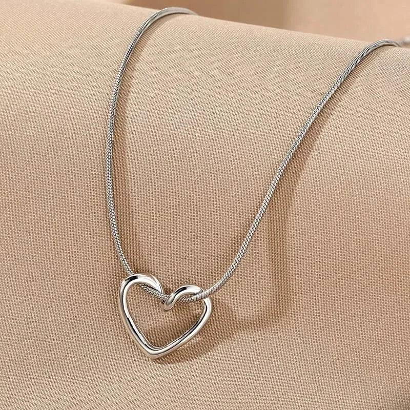 Geometric Hollow Heart Necklace – Modern Minimalist Pendant for Women.