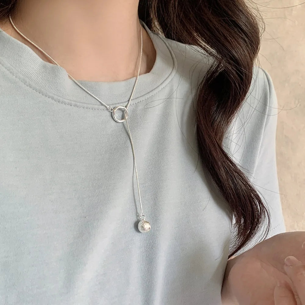 Brushed Silver Ball Necklace – Minimalist Geometric Long Chain Jewelry.