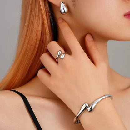 Elegant Water Drop Jewelry Set – Open Bangle, Teardrop Ring & Earrings for Effortless Modern Chic.