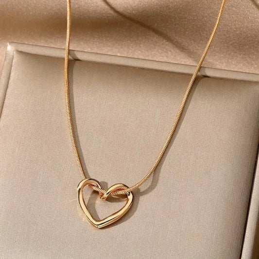 Geometric Hollow Heart Necklace – Modern Minimalist Pendant for Women.