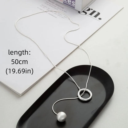 Brushed Silver Ball Necklace – Minimalist Geometric Long Chain Jewelry.