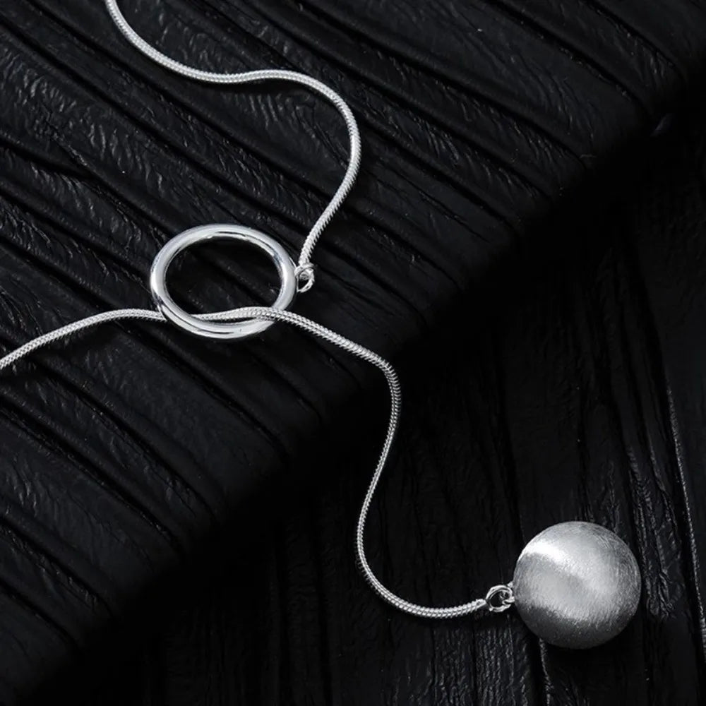 Brushed Silver Ball Necklace – Minimalist Geometric Long Chain Jewelry.