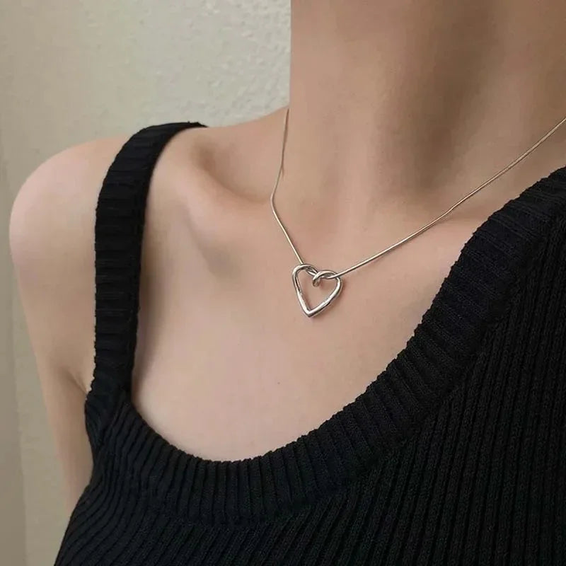 Geometric Hollow Heart Necklace – Modern Minimalist Pendant for Women.
