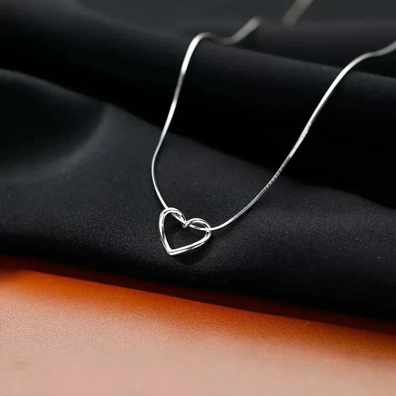 Geometric Hollow Heart Necklace – Modern Minimalist Pendant for Women.