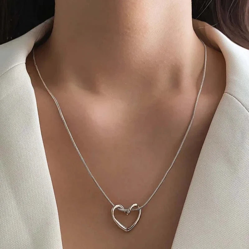 Geometric Hollow Heart Necklace – Modern Minimalist Pendant for Women.