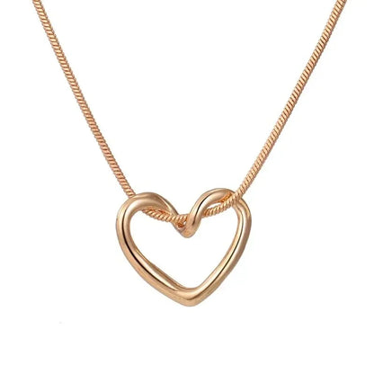Geometric Hollow Heart Necklace – Modern Minimalist Pendant for Women.