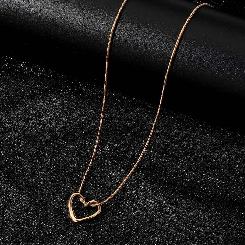 Geometric Hollow Heart Necklace – Modern Minimalist Pendant for Women.